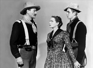 John Wayne, Maureen O'Hara, Claude Jarman, Jr. in scene from 1950's film Rio Grande