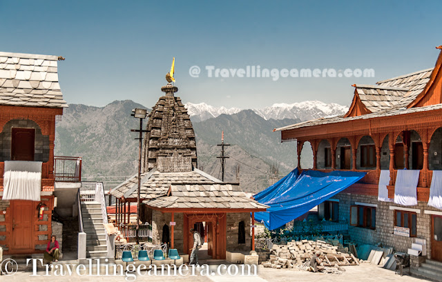 Recently some of us were on Kinnaur Trip and there is place called Jeory on the way. Sarahan is approximately 30 kilometers from Jeory and it's a beautiful town located on hill-top with amazing views of snow covered hills of Kinnaur. Bheemakali temple of Sarahan is most popular place to visit and this Photo Journey shares some of the moments spent around Bheema Kali Temple.Bheema Kali Temple has a huge campus and different temples inside the campus. There are two main temples, out of which one is accessible to everyone during normal days.The Second one is opened on some special occasions and Devi only allows Raja Virbhadra Singh to open the door of that temple. Shri Bheema Kali Temple is located in Sarahan town of Himachal Pradesh in India which is dedicated to the mother goddess Bhimakali, presiding deity of the rulers of former Bushahr State. The temple is situated about 180 km from Shimla and is one of 51 Shakti Peethass. The temple complex has another three temples dedicated to Lord Raghunathji, Narsinghji and Patal Bhairva Ji (Lankra Veer) - the guardian deity.Architecture of Bheema Kali Temple is beautiful. Whole campus is built with Stone and wooden blocks. It seems some part of the campus has not even cement to fix the joints. Whole campus is very well maintained and there is enough security as well.Here is one of the doors of the Bheem Kali temple in Sarahan Town. It's made up of silver with beautiful carving. There is also some text written, mostly in Hindi and Tibbatian scripts. Most of the carved forms are different gods and linked through some old stories.Sarahan was the capital of rulers of former Bushahr State. Bushahr dynasty earlier used to control the state from Kamroo. The capital of state later was shifted to Sonitpur. Later Raja Ram Singh made Rampur as the capital. It is believed that the country of Kinnaur was the Kailash mentioned in Puranas, the abode of Shiva. With its capital at Sonitpur this former princely state was extended up to entire area of Kinnaur where for sometimes Lord Shiva disguised himself as Kirata. Today, the then Sonitpur is known as Sarahan. Banasura, the ardent devotee of Lord Siva, eldest among the one hundred sons of great ablative demon King Bali and the great grandson of Vishnu votary Prahlad, during the Puranic age was the ruler of this princely state.(Courtesy - http://en.wikipedia.org/wiki/Bhimakali_Temple)According to a legend, the manifestation of the goddess is reported to the Daksha-Yajna incident when the ear of the Sati fell at this place and became a place of worship as a Pitha - Sthan. Presently in the form of a virgin the icon of this eternal goddess is consecrated at the top storey of the new building. Below that storey the goddess as Parvati, the daughter of Himalaya is enshrined as a divine consort of Lord SivaThere is a small market around Bheema Kali Temple and there are enough shops to have lunch or light snacks. Apart from that local caps can be bought from this fellow. He was very welcoming and offered good discounts for us :). We had asked for rates in Rampur Market, but he had better stuff and reasonable prices. There are many other shops in the town where some local stuff can be procured. On top of all that, most of the folks were really sweet to interact with.During our visit, we were looking for ladies wearing Dhaatu but couldn't gain the courage to ask anyone to get clicked by us. And just outside the Bheema Kali temple, this lady asked us to click one of her photograph and show her how we click. Probably she was noticing us clicking & reviewing photographs around the temple. We clicked few shots and showed to her. She shared some tips to improve and finally approved few of the shots. After final approval, she invited us to her hotel nearby but we couldn't go because it was time to head back as we had booked guest-house in Jeory.Here is a nearby sight, which is popularly known as Hawa-Ghar. This point has very clear view of Kinnar-Kailash Hills and place was quite windy. We spent around 30 minutes here to enjoy the breeze and take rest. This place is isolated form hustle bustle of the town. When we reached, there was only one person sitting here. Probably this place was least used by localites, as everyone has Hawa-ghar around their own houses :)Whole place was surrounded by Pine or Deodar Forests and smell was awesome in the middle of these forests. It was really an amazing experience to roam around Bheema Kali Temple and Sarahan Town. Meeting different people, visiting one of the amazing temples in this region, Hawa Ghar, a huge house of old kingdom etc.The town Sarahan is known as the gateway of Kinnaur. Down below at a distance of 7 km from Sarahan is the River Satluj. Sarahan is identified with the then Sonitpur mentioned in Puranas.Before entering into the main temple, everyone needs to lock mobiles, wallets or anything else which is made of leather and then wear a cap. Above photograph shows Aneesh wearing the holy cap and standing on right side of lockers everyone gets to keep everything safe.