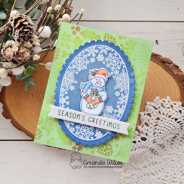 Season's Greetings Snowman Card by Amanda Wilcox | Snowman Greeting Stamp Set, Snowflake Oval Stamp Set, Oval Frames Die Set, Holiday Greetings Hot Foil Plates and Holiday Foliage Stencil by Newton's Nook Designs #newtonsnook #handmade