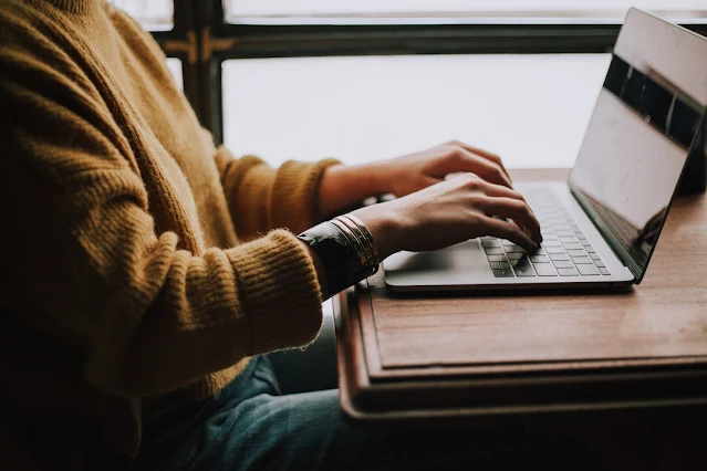 Woman using a laptop to analyze customer insights with data analytics for competitive advantage