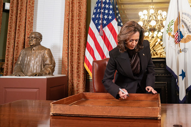 Before departing the White House, Kamala Harris signs a desk; social media responds, "You'll be missed."