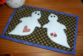 http://www.craftsy.com/pattern/quilting/home-decor/ghostly-duo-mug-rug/59473