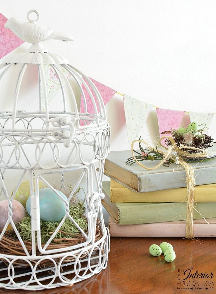 These pretty pastel painted hardcover book stacks with French Country style are an easy budget-friendly Spring decorating idea by recycling old books.