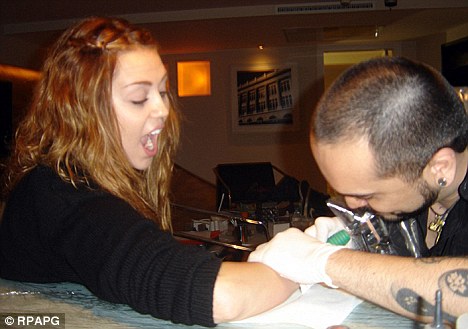 miley cyrus tattoo on her stomach