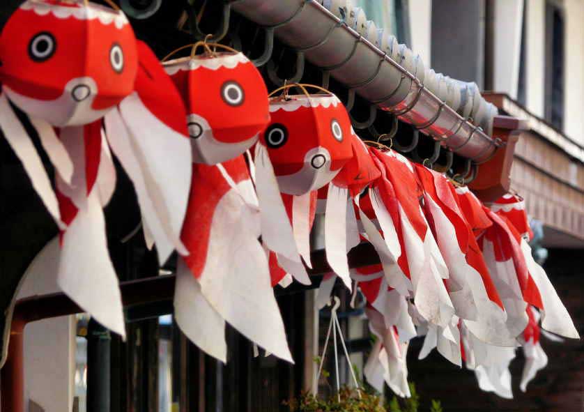 Goldfish lanterns strung above historic buildings in Yanai, Yamaguchi.