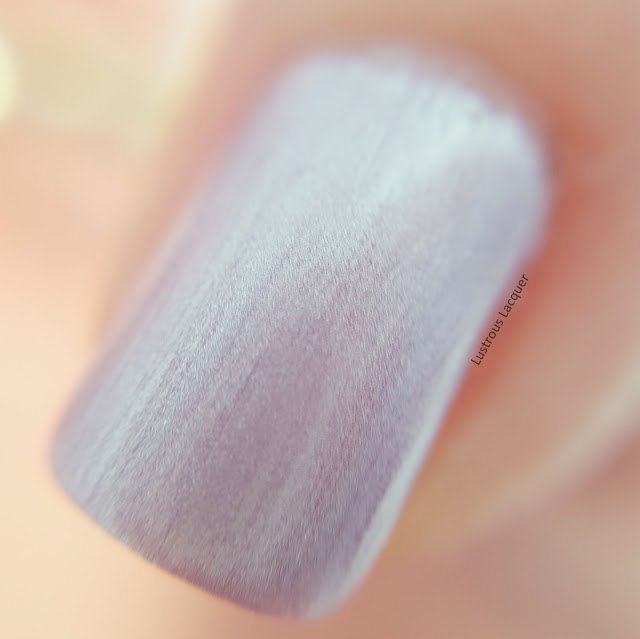 Icy Pink nail polish with a purple undertone and a pearl finish from the Pastel City Collection