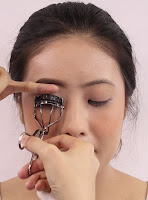 Give a lashes a good squeeze before putting on falsies.