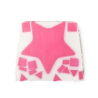 A square piece of pink soap with a white star in the middle of it on a bright background