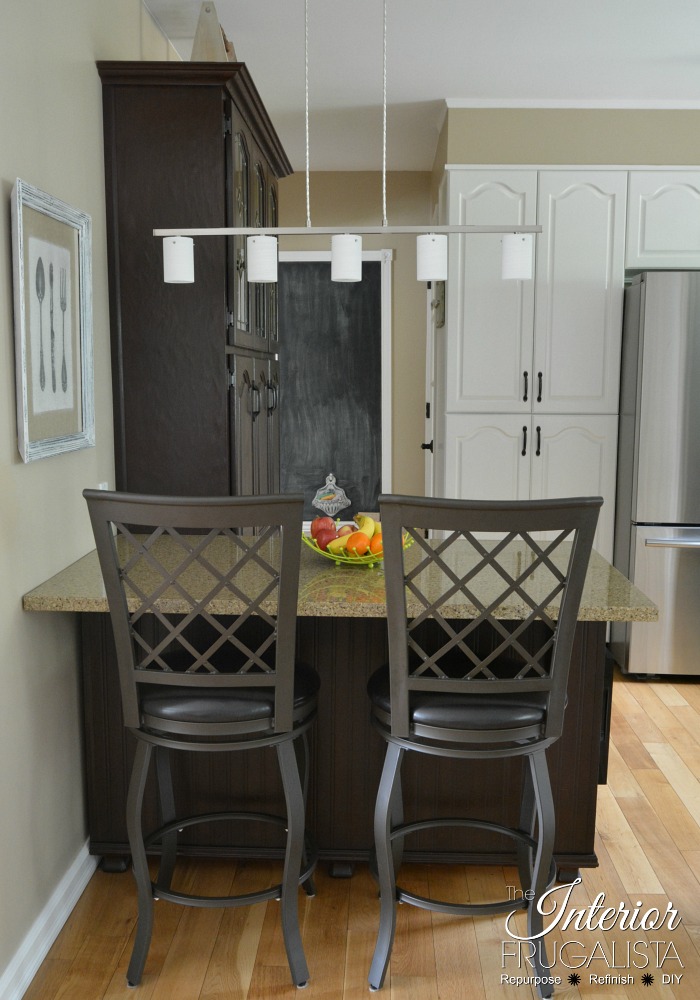 A clever China Cabinet Hack! How to repurpose a small dining hutch into a kitchen pantry AND small kitchen island for a budget kitchen makeover idea.