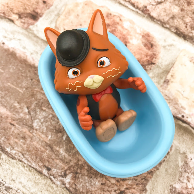 Gas character sitting in his bath accessory