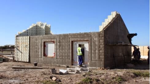 Formwork removed to reveal house structure. 