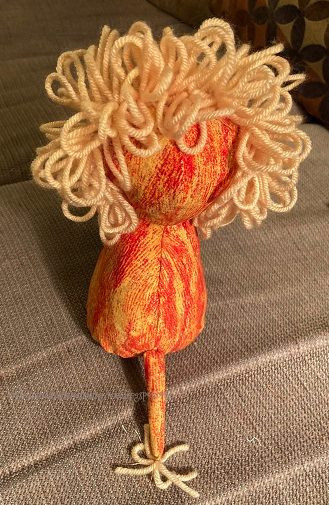 Small stuffed orange and yellow lion.