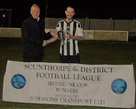 Neil Johnson of sponsors Johnson's Transport Ltd presenting the victorious Briggensians captain Jason North with the Ironstone Cup - April 2019
