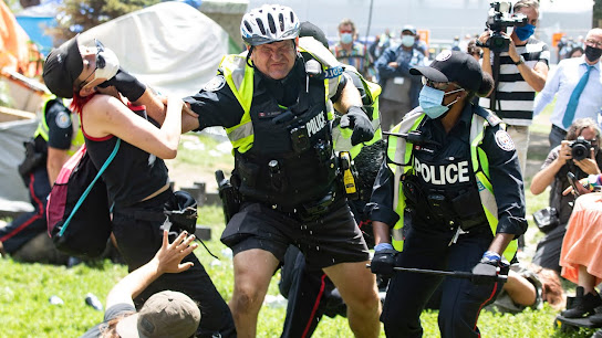 police homeless violence protesters Toronto brutality