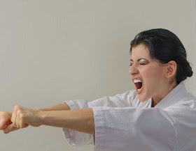 Lady in the middle of a martial arts pose