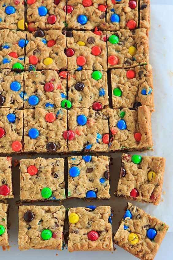 Monster cookies baked into bar cookies - peanut butter dough loaded with oats, chocolate chips and M&M's.