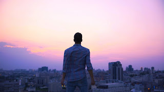 man watching a sunrise