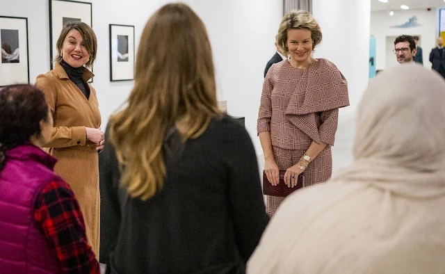 Queen Mathilde wore a pink outfit, top and trousers, by Natan  at the M-Museum. Crown Princess Elisabeth and Princess Eleonore