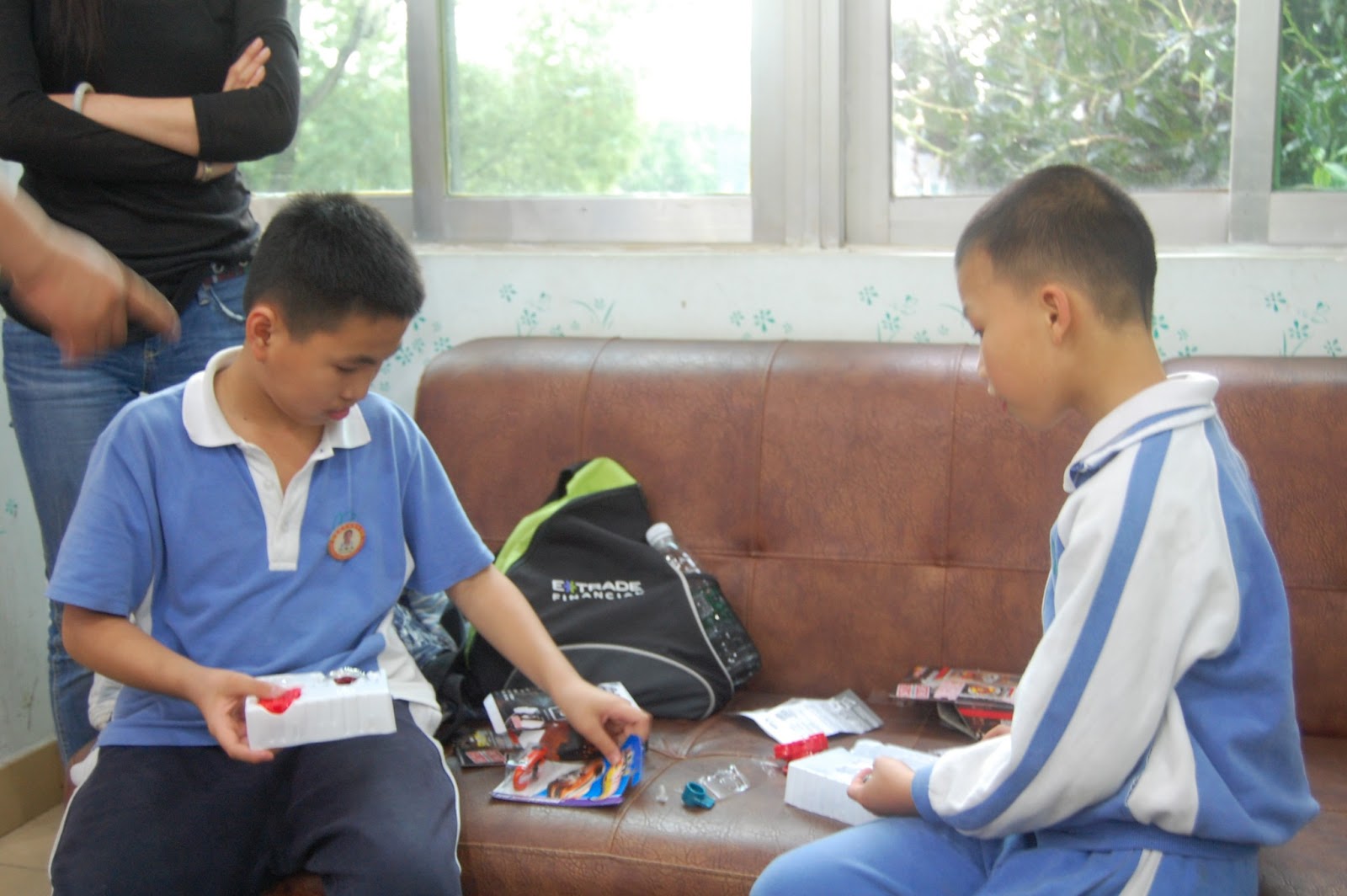 The boys look at their gifts from Mama and Baba in America