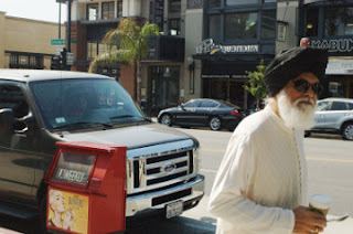 expressive older man walks with cup coffee  6-25-16 Old Town Pasadena