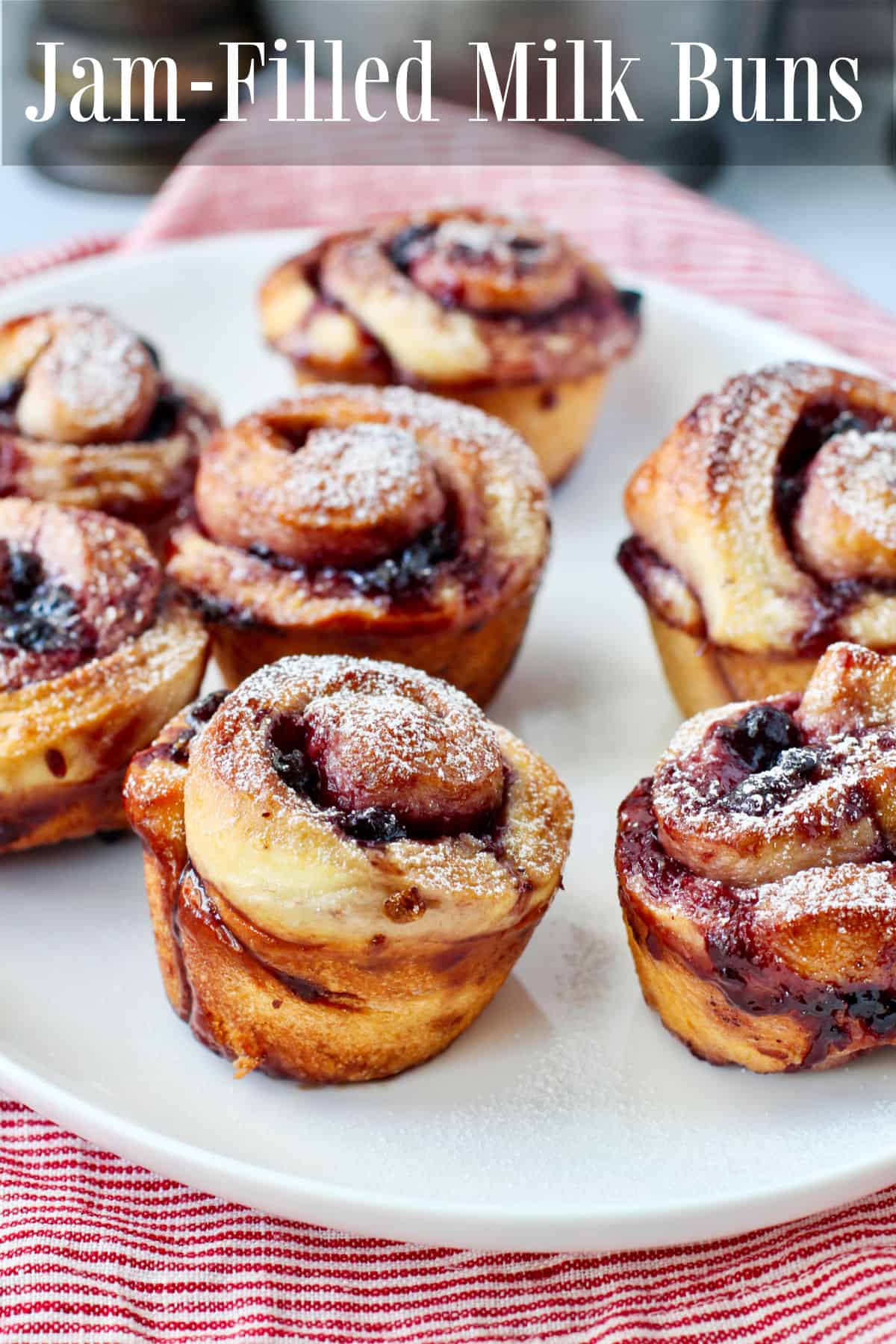 Pomegranate and Blueberry Jam Milk Buns on a white tray.