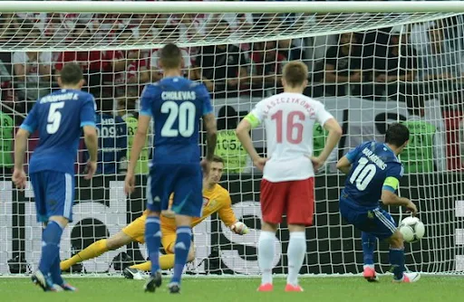 Giorgos Karagounis performs a penalty kick saved by Przemyslaw Tytoń
