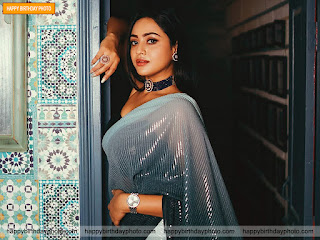 standing at door in grey color saree