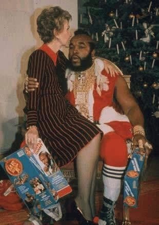 Mr T with a grandma on his lap under mistletoe