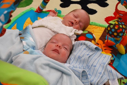 boys sleeping on playmat