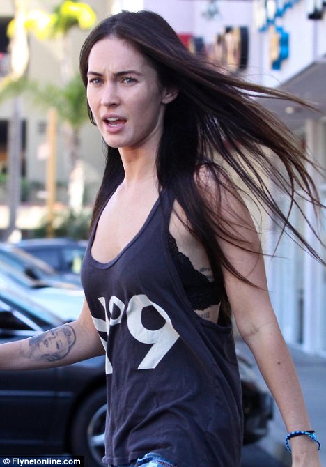 Fresh faced Megan Fox goes makeup free as she exposes bra in revealing vest