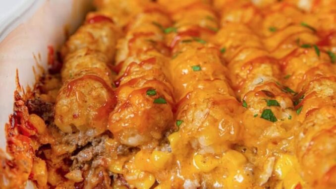 1/2 pound ground beef, (85/15)  1 cup of corn  2/3 cup Condensed Cream of Mushroom Soup  1 cup cheddar cheese, shredded and divided  1/3 cup whole milk  1/4 cup sour cream  1 teaspoon onion powder  1/2 teaspoon black pepper  32 ounces tater tots