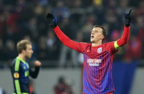 Steaua Bucureşti player Vlad Chiricheş celebrates after scoring a goal against Ajax