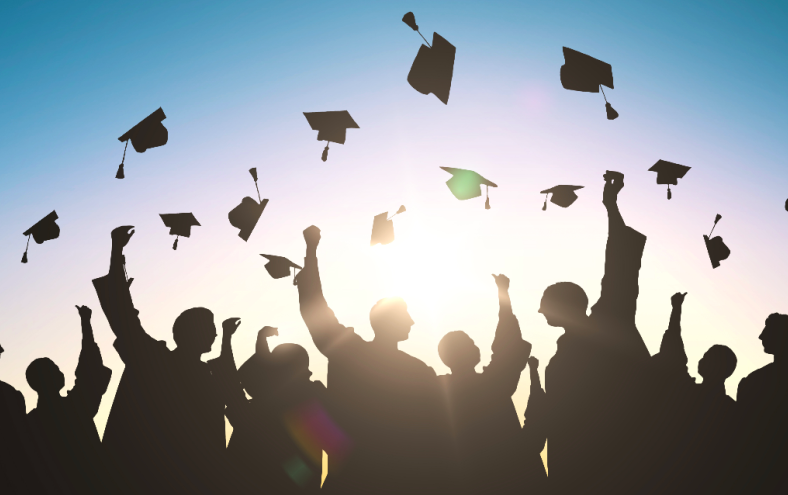 a group of student throwing up caps