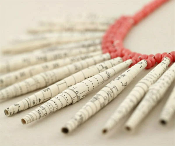 paper bead necklace made of rolled book pages and salmon color glass beads