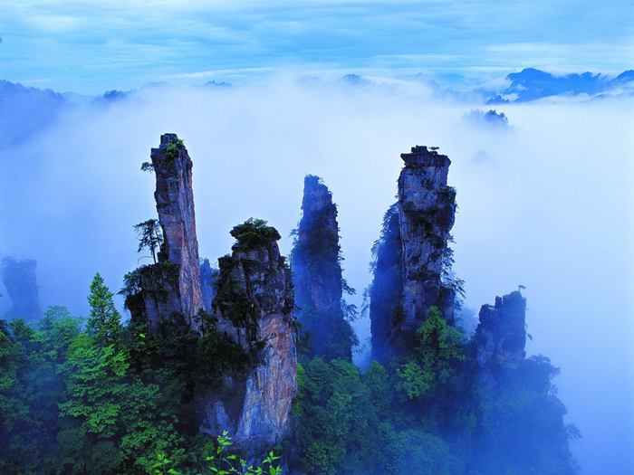 Wulingyuan - cliffs in Zhangjiajie National Park, which is located in Hunan Province in the southeast of China. This is a place of amazing beauty and at the same time a natural zoo, botanical and geological reserve. The place is famous for its quartzite cliffs up to 800 meters. The highest peaks of Wulingyuan reach a height of more than 3 km above sea level. Mountains are a picturesque sight: the huge stone pillars above the rainforest cut by sharp peaks, waterfalls, a giant cave system. 