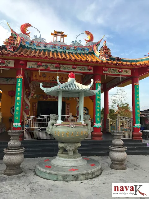 Red, green and gold traditional architecture of a Chinese Temple entrance, Crab Island, Malaysia.
