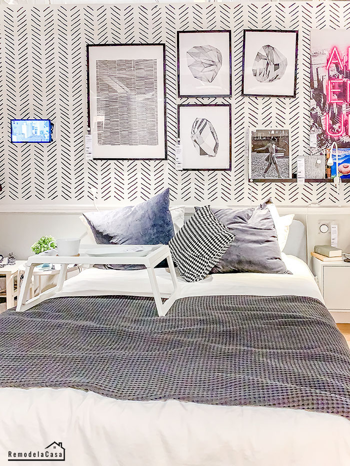 White bedroom with modern herringbone wallpaper