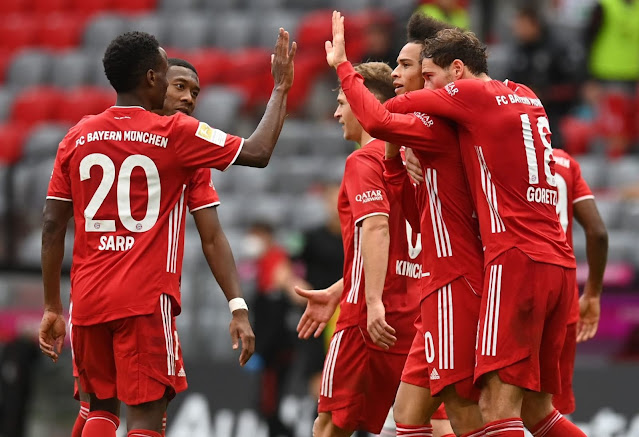 Bundesliga champions Bayern Munich players celebrate a goal