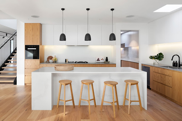 Wooden Stools in a White Kitchen