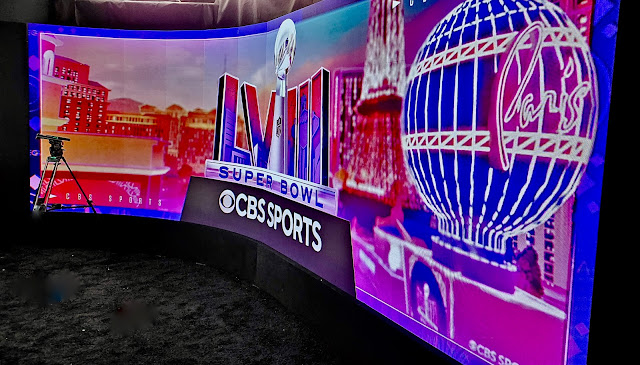 The curve of the 26-ft. LED screen inside the CBS Super Bowl booth coupled with the curve of the camera rail will offer a variety of looks.