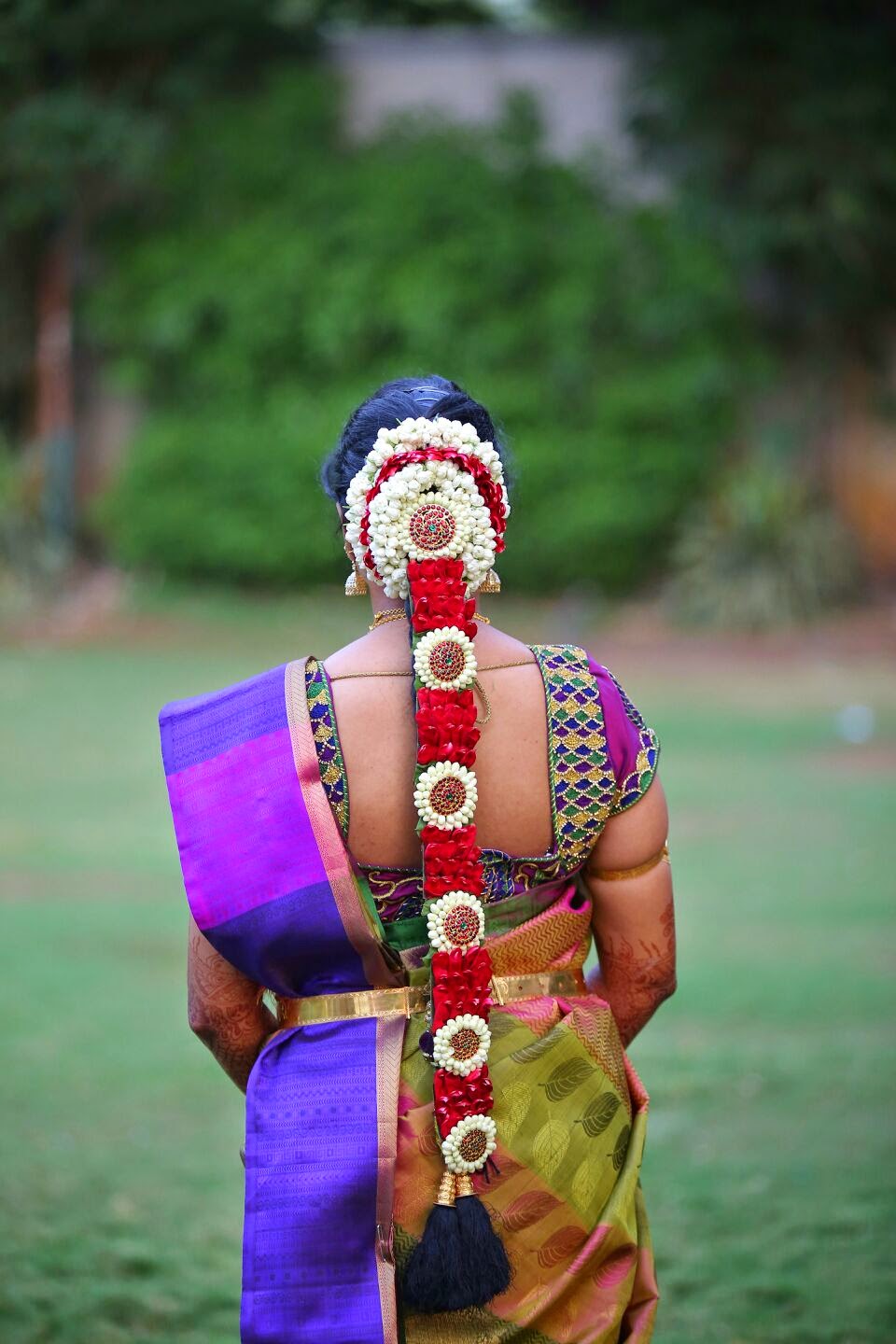 Indian woman bridal hair style attached with jasmine flowers decoration and  neck Stock Photo - Alamy