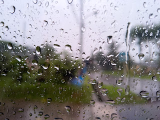 Glass with blurred view because of raindrop