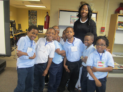 Staff member and kids at a library program