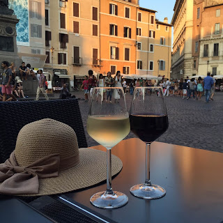Glasses of wine at aperitivo hour overlooking the Campo de' Fiori, Rome, Lazio, Italy