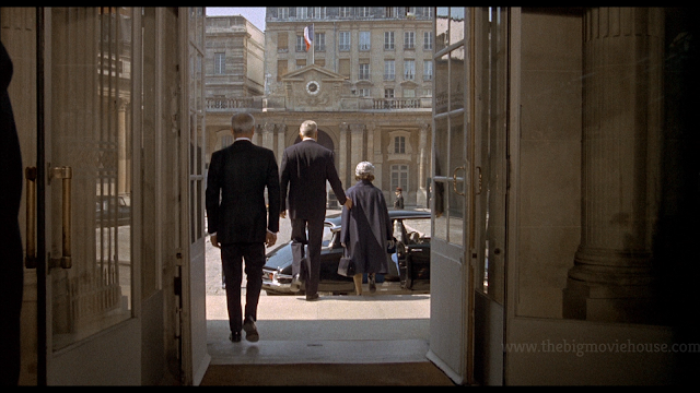 guy and lady walk down stairs