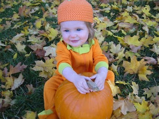 halloween baby with pumpkin