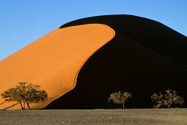 Photography of a mountain in desert 