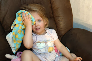 Rosie holding frozen peas in place