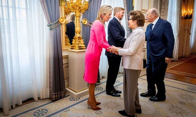 Queen Maxima wore a pink midi dress by Natan Couture, red flower earrings. The Order of the House of Orange