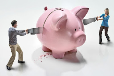 K'Mich Weddings - wedding planning - woman and man sawing a pink piggy bank in half